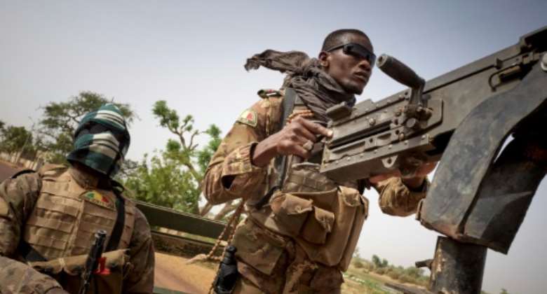 Malian soldiers on patrol between Mopti and Djenne.  By MICHELE CATTANI (AFP/File)
