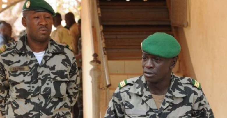 Malian junta leader Amadou Sanogo R speaks in Kati.  By Habibou Kouyate AFP