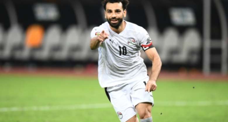 Mohamed Salah celebrates after scoring the winning penalty for Egypt against the Ivory Coast.  By CHARLY TRIBALLEAU AFP