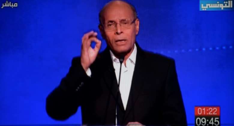 Moncef Marzouki is pictured on TV speaking during a debate for presidential candidates on September 7, 2019 in Tunis, an election he lost to Kais Saied.  By FETHI BELAID (Ettounsiya TV channel/AFP/File)