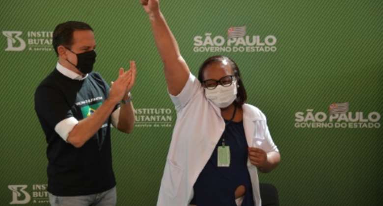 Monica Calazans, a 54-year-old nurse in Sao Paulo became the first person in Brazil to receive the Chinese CoronaVac jab after two vaccines were approved.  By NELSON ALMEIDA AFP