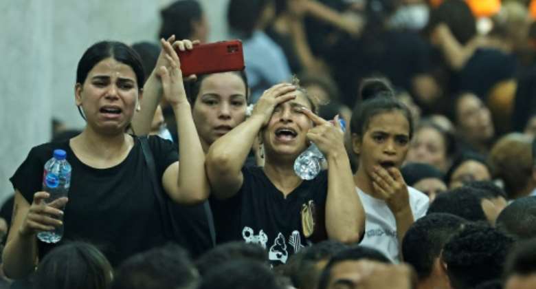 Mourners at the funeral of victims killed in Sunday's Coptic church fire in the Imbaba neighbourhood of greater Cairo.  By Khaled DESOUKI AFP