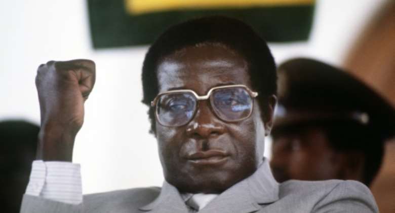 Mugabe, pictured in July 1984 at the height of his 37 years in power.  By ALEXANDER JOE AFP