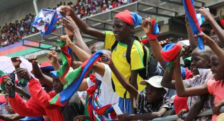 Namibian SWAPO supporters cheer during the last campaign rally on November 22, 2014 at the Sam Nujoma stadium in Windhoek.  By Jordaania Andima AFPFile