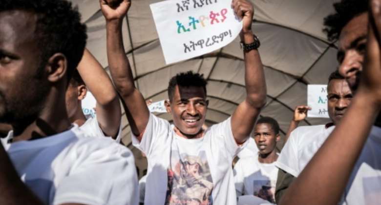 New military recruits brandished placards attacking purported fake news at a sending-off ceremony in Addis Ababa on Wednesday.  By Amanuel Sileshi AFP