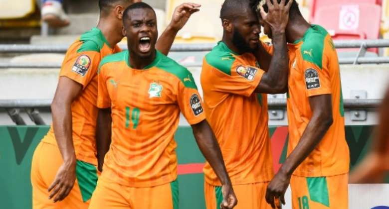 Nicolas Pepe 2nd L and his Ivory Coast teammates celebrate after Franck Kessie put them ahead against Algeria.  By CHARLY TRIBALLEAU AFP