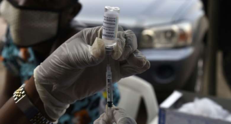 Nigeria and Ghana have both reported cases of Omicron variant, while they both roll out mass Covid vaccine campaigns.  By PIUS UTOMI EKPEI AFP