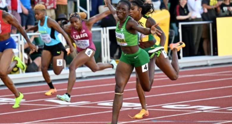 Nigeria's Tobi Amusan storms to victory in the women's 100m hurdles.  By ANDREJ ISAKOVIC AFP