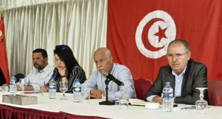 Noureddine Taboubi, on the right, the secretary-general of the Tunisian General Labour Union, chairs a meeting on May 23, 2022.  By Khalil KSIBI AFP