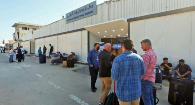Passengers wait to depart Libya's Mitiga International Airport in Tripoli as flights resume.  By Mahmud TURKIA AFP