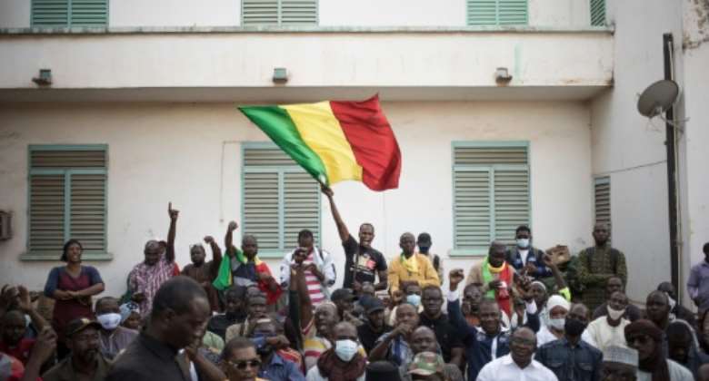 People in Bamako protest against newly imposed sanctions against Mali over the junta's delaying of promised elections.  By FLORENT VERGNES AFPFile