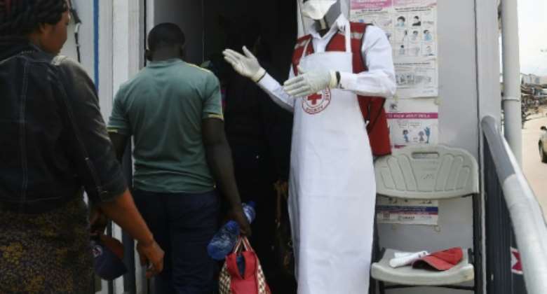 People who are infected with Ebola do not become contagious until symptoms appear.  By ISAAC KASAMANI AFPFile