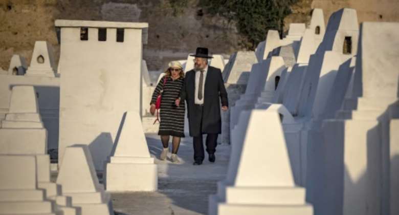 Pilgrims walk among the restored gravestones of the Jewish cemetery in the Moroccan city of Meknes, reviving a tradition that had lapsed since the 1960s.  By FADEL SENNA AFP