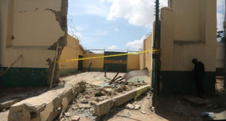 Police cordoned off a section of the prison that was destroyed in the attack.  By Kola Sulaimon AFP