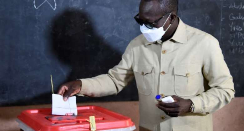 President Patrice Talon casting his ballot in the April 11 election. Several opposition leaders were detained before or just after the vote.  By PIUS UTOMI EKPEI AFP