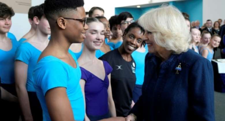 Queen Consort Camilla met 13-year-old Nigerian dancer Anthony Madu at a ballet school in the UK.  By Frank Augstein POOLAFP