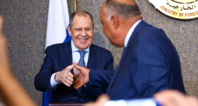 Russian Foreign Minister Sergei Lavrov is greeted by Egyptian counterpart Sameh Shoukry on the first leg of an African tour focused on reassuring customers of Russian grain that their needs will be met.  By Handout RUSSIAN FOREIGN MINISTRYAFP