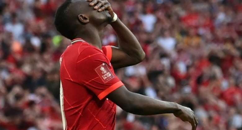 Sadio Mane reacts after missing his penalty during an FA Cup final shootout victory over Chelsea at Wembley stadium on May 14, 2022..  By Glyn KIRK AFP