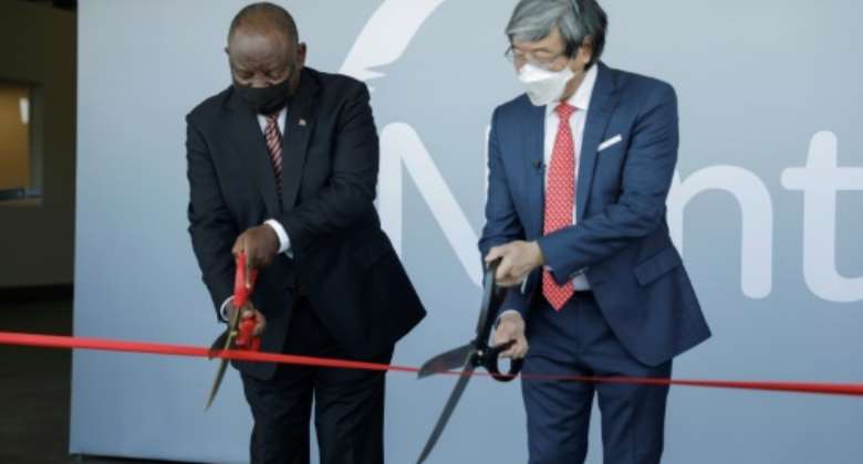 Scissor ceremony: President Cyril Ramaphosa, left, joins biotech tycoon Patrick Soon-Shiong in launching the vaccine hub.  By GIANLUIGI GUERCIA POOLAFP