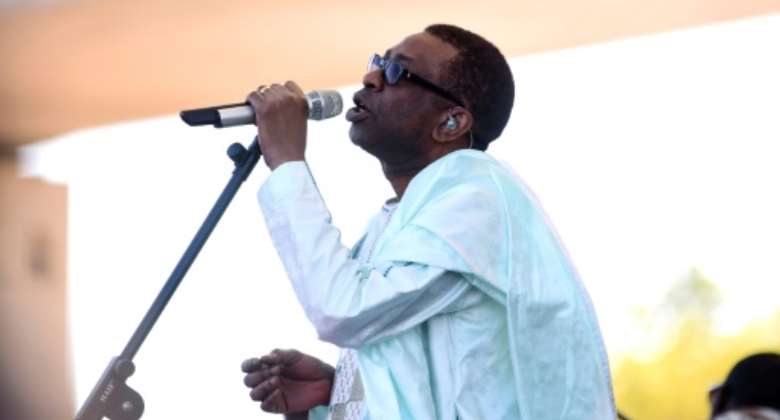 Senegalese superstar Youssou N'Dour joined a galaxy of African talent for a virtual concert to raise awareness of the coronavirus pandemic.  By Seyllou (AFP/File)
