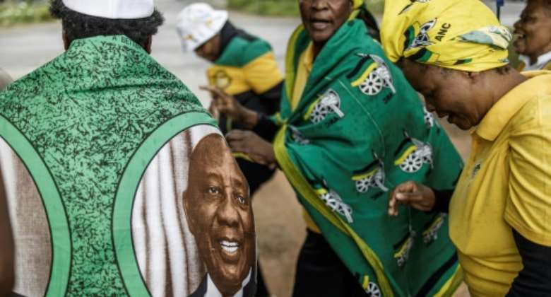 Show of support: Ramaphosa loyalists outside Monday's talks.  By Marco Longari AFP