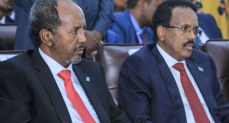Somalia's newly-elected president, Hassan Sheikh Mohamud, next to his predecessor Mohamed Abdullahi Mohamed in Mogadishu on Monday.  By Hasan Ali Elmi AFP