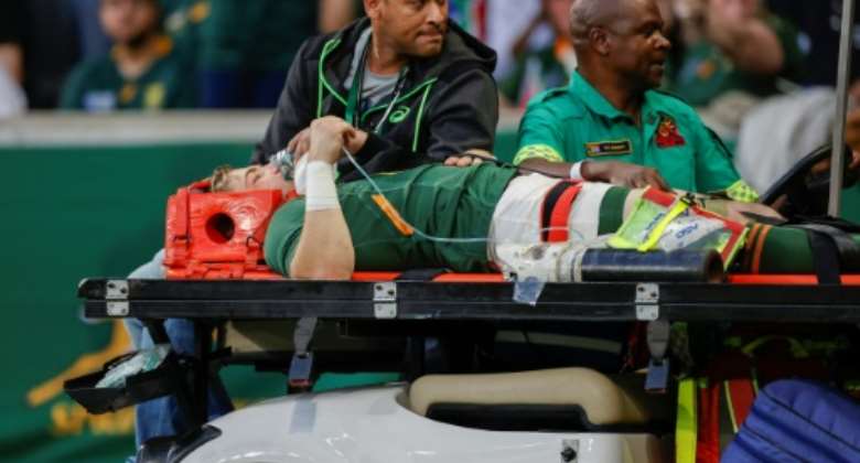 South Africa scrum-half Faf de Klerk is taken off on a stretcher after being injured during the Rugby Championship match against New Zealand in Mbombela on August 6, 2022..  By PHILL MAGAKOE AFP