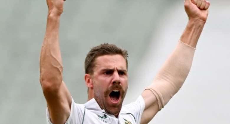 South Africa's Anrich Nortje celebrates dismissing Australia's David Warner.  By William WEST AFP