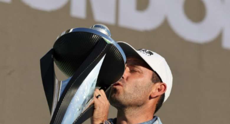 South Africa's Charl Schwartzel celebrates victory in the LIV Golf Invitational London.  By Adrian DENNIS AFP