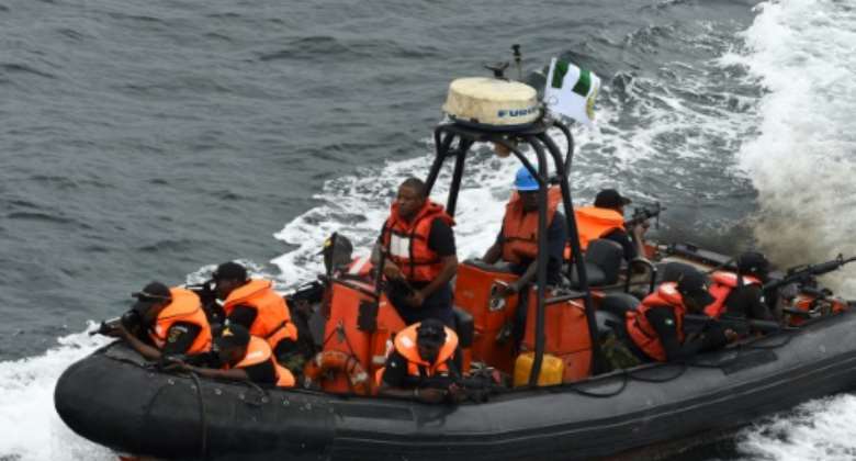 Special forces of the Nigerian navy sail to apprehend pirates in a mock operation during joint exercises with France in Nigerian waters in October 2019.  By PIUS UTOMI EKPEI AFPFile