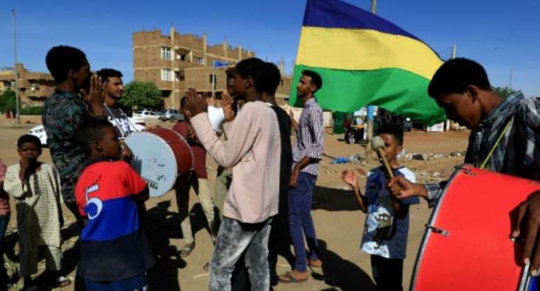 Sudanese activists visit families of protesters killed in a bloody crackdown since last year's military coup.  By - AFP