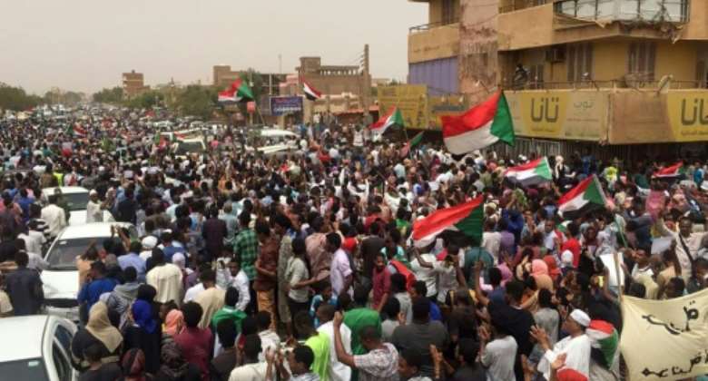 Sudanese protesters chant slogans demanding civilian rule during a rally in Khartoum's southern al-Sahafa district.  By - AFP