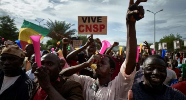 Supporters of the military junta, which calls itself the National Committee for the Salvation of the People, or CNSP, take part in a rally in Bamako this week.  By MICHELE CATTANI AFPFile