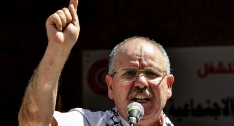 The head of Tunisia's UGTT trade union confederation addresses supporters on June 16, the first day of a nationwide strike opposing the government's proposals for IMF-backed reforms.  By FETHI BELAID AFPFile