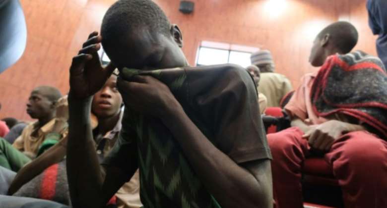 The latest mass kidnapping comes just two months after hundreds of schoolboys were abducted in Kankara, in northwestern Nigeria. Pictured: Kidnapped boys after their release.  By Kola SULAIMON AFPFile
