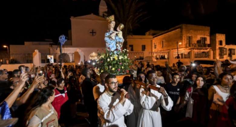 The Madonna of Trapani procession started after Tunisia's Muslim ruler Ahmed Bey -- whose mother was a Sardinian Christian -- gave a piece of land for building a church in 1848.  By FETHI BELAID AFP