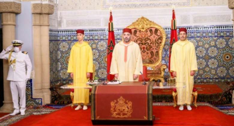 This handout picture released by the Moroccan National Press Agency shows Moroccan King Mohammed VI, flanked by his brother brother Prince Moulay Rachid and son Crown Prince Moulay Hassan.  By - MAPAFP