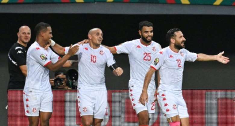 Tunisia captain Wahbi Khazri 2L celebrates scoring against Mauritania.  By Issouf SANOGO AFP