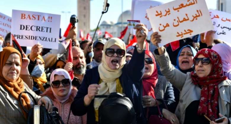 Tunisians protest in front of parliament in the capital Tunis on November 14, 2021 against President Kais Saied's power grab.  By FETHI BELAID (AFP)