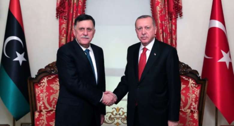 Turkish President Recep Tayyip Erdogan R meets with Fayez al-Sarraj, the head of the Tripoli-based Government of National Accord in Istanbul on November 27, 2019.  By Mustafa Kamaci TURKISH PRESIDENTIAL PRESS SERVICEAFPFile