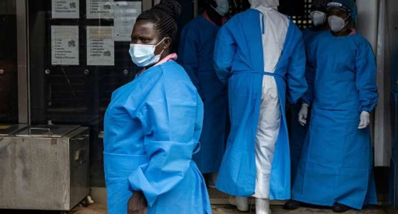 Ugandan medical staff treating Ebola patients at Mubende Regional Referral Hospital last month..  By BADRU KATUMBA AFP