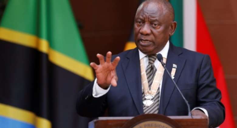 Under pressure: Ramaphosa, speaking at a press conference Thursday with Tanzanian President Samia Suluhu Hassan.  By PHILL MAGAKOE AFP