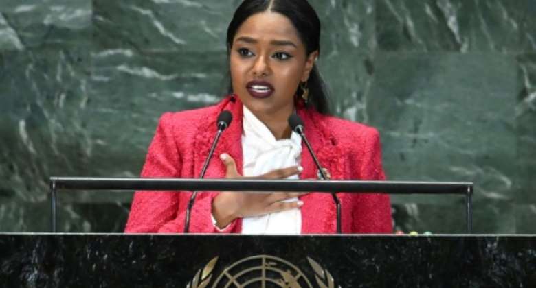 Youth activist from Sudan Mayada Adil speaks at the opening session of the second Sustainable Development Goals SDG Summit in New York.  By TIMOTHY A. CLARY AFP