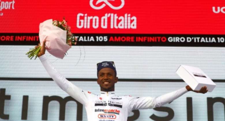Youthful promise: Biniam Girmay celebrates after pulling on the best young rider jersey in the Giro d'Italia.  By Luca BETTINI AFP