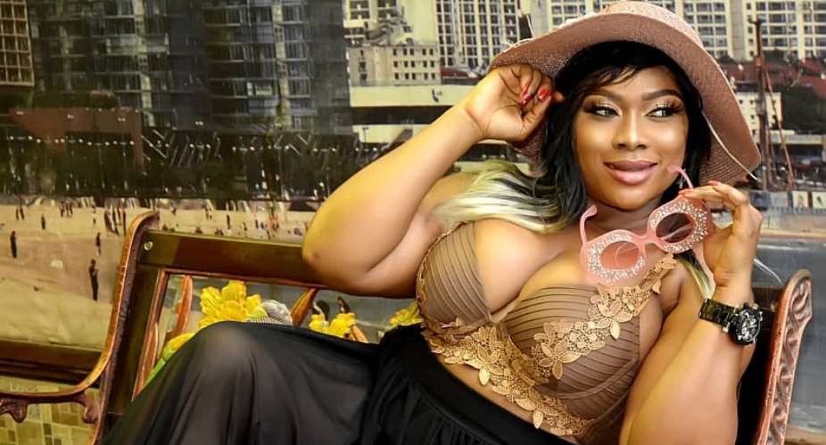 Nollywood Actress Queeneth Agbor Flashes heavy cleavage in new birthday shoot.
