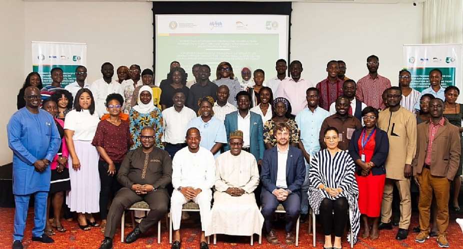 Participants and organizers in a group photograph