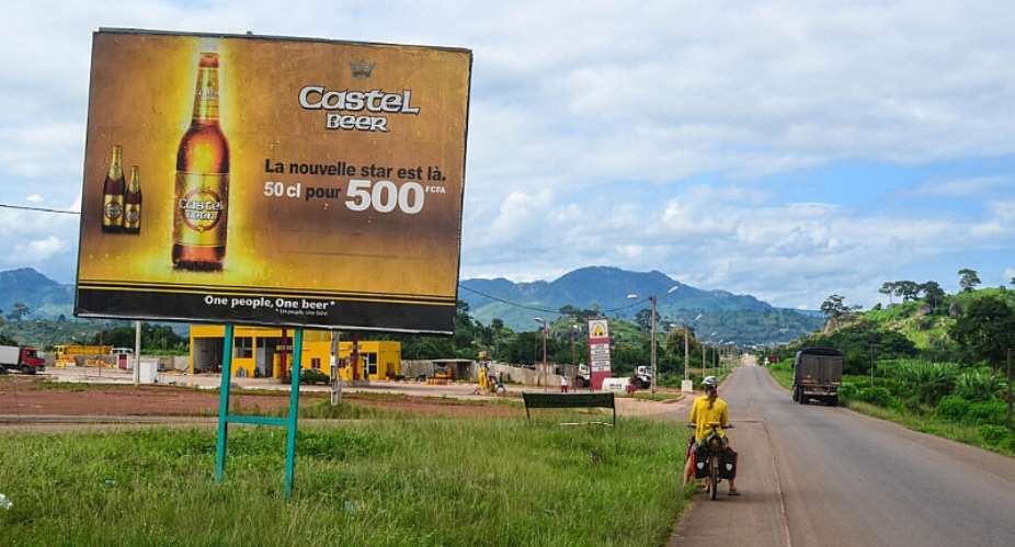 An advert for Castel Beer near Mahapleu in western Cte dIvoire in 2013. The French-founded Castel Group is the second-largest producer of beer and soft drinks in Africa. -  jbdodane, CC BY-NC 2.0 via Flickr