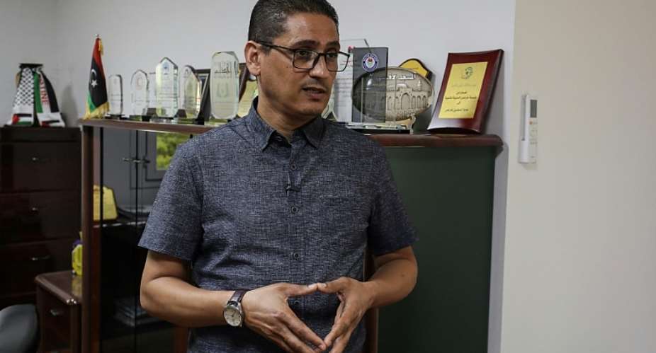 Ashraf Abu Rawi, spokesperson for Libyas teachers union, speaks with an AFP journalist at his office in Tripoli on September 27, 2026, during a teachers strike demanding higher salaries and better working conditions. — Mahmud Turkia / AFP
