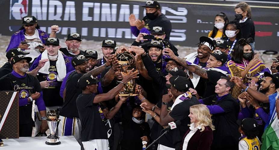 The Los Angeles Lakers celebrate after defeating the Miami Heat 106-93 in Game 6 of the NBA Finals, winning the franchise's 17th title.