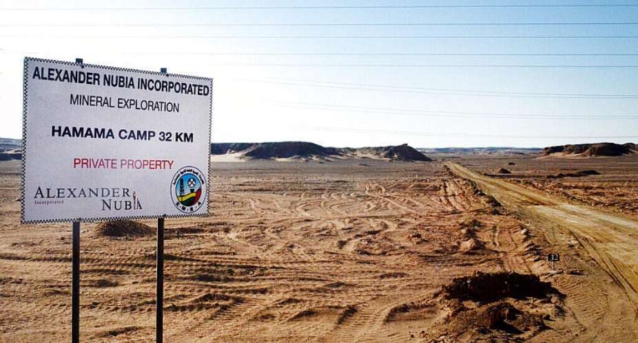 Photo shows a sign marking the turn-off leading to the Hamama gold exploration site, deep in the desert east of Luxor, Egypt, April 15, 2016. -  Brian Rohan, AP